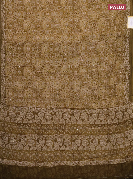 Chanderi silk cotton saree mustard green with allover prints & mirror work and printed border