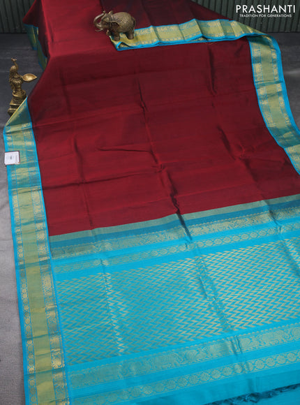 Kuppadam silk cotton saree maroonn and teal blue with plain body and rich zari woven border