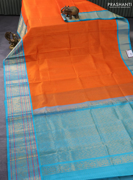 Kuppadam silk cotton saree orange and teal blue with allover small zari checked pattern and long zari woven border