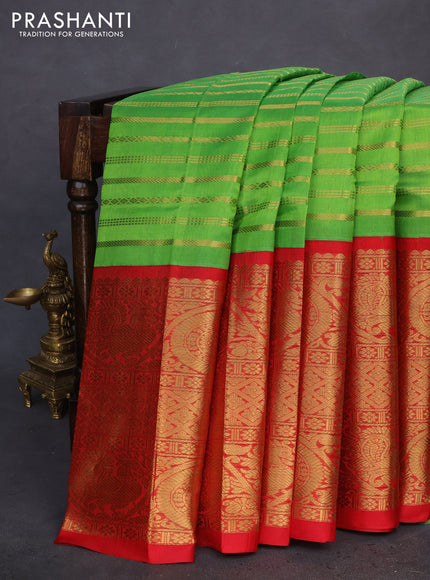 Kuppadam silk cotton saree green and red with allover zari woven stripes pattern and long zari woven border