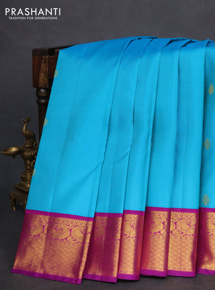 Pure kanchipuram silk saree teal blue and purple with zari woven buttas and annam zari woven korvai border