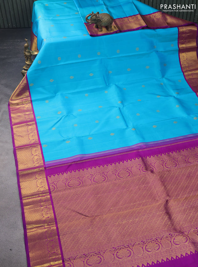 Pure kanchipuram silk saree teal blue and purple with zari woven buttas and annam zari woven korvai border