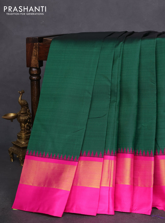 Pure kanchipuram silk saree green and pink with plain body and teample design zari woven border