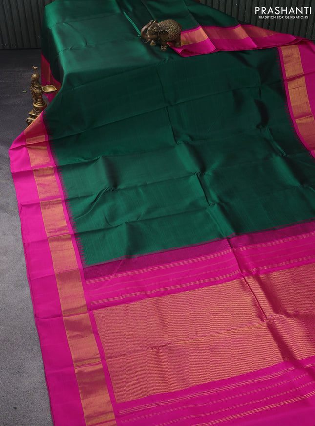 Pure kanchipuram silk saree green and pink with plain body and teample design zari woven border