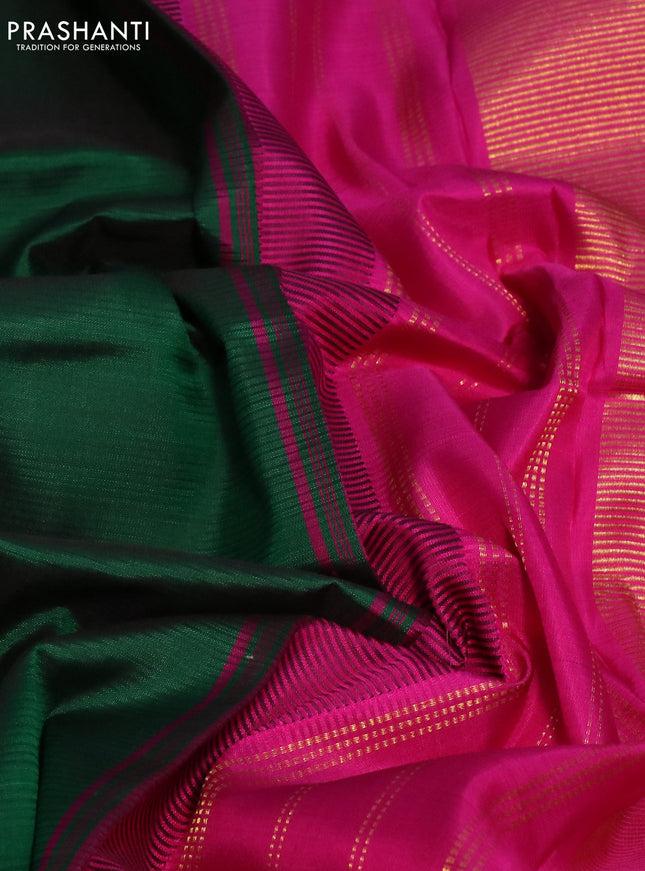 Pure kanchipuram silk saree green and pink with plain body and teample design zari woven border