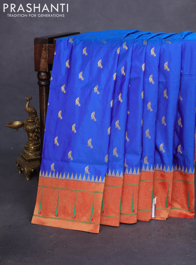 Pure paithani silk saree dual shade of blue and red with zari woven peacock buttas and zari woven muniya butta border