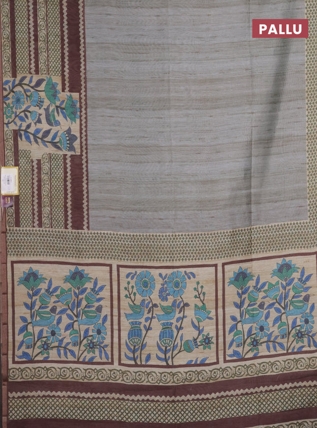 Semi tussar saree grey shade and brown with plain body and long printed zari border