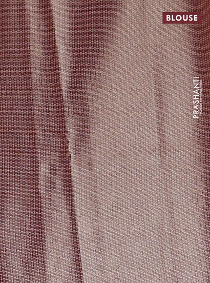 Tissue saree rust shade with embroidery work buttas and temple design zari border