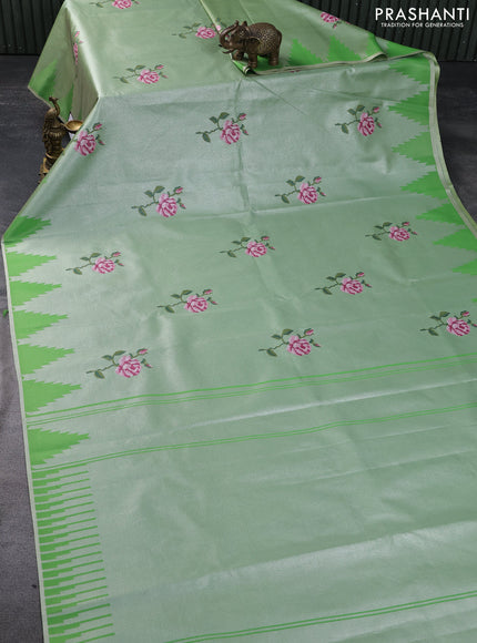 Tissue saree green with embroidery work buttas and temple design zari border