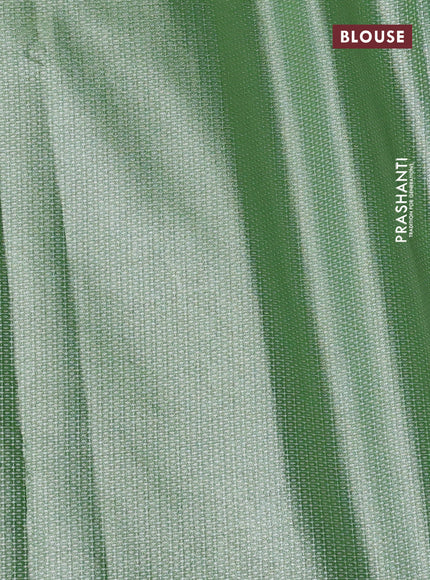 Tissue saree green with embroidery work buttas and temple design zari border