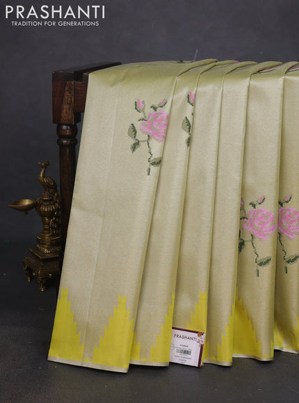 Tissue saree lime yellow with embroidery work buttas and temple design zari border
