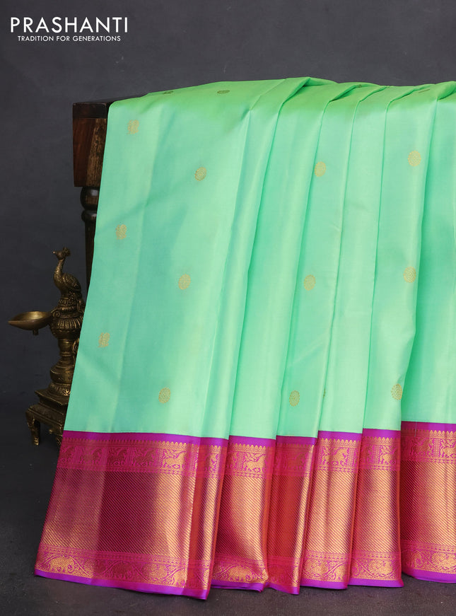 Pure kanchipuram silk saree teal green shade with zari woven buttas and ganga jamuna border