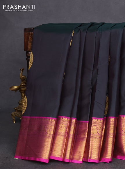 Pure kanchipuram silk saree bottle green and magenta pink with zari woven paisley buttas and zari woven annam border