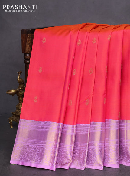 Pure kanchipuram silk saree dual shade pinkish orange and lavender shade with zari woven buttas and zari woven korvai border