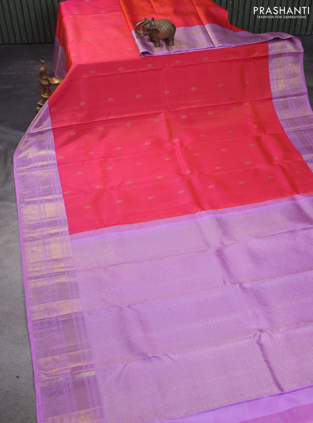 Pure kanchipuram silk saree dual shade pinkish orange and lavender shade with zari woven buttas and zari woven korvai border