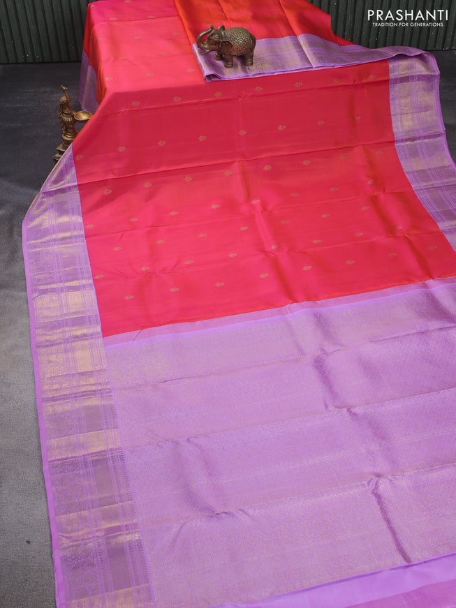 Pure kanchipuram silk saree dual shade pinkish orange and lavender shade with zari woven buttas and zari woven korvai border