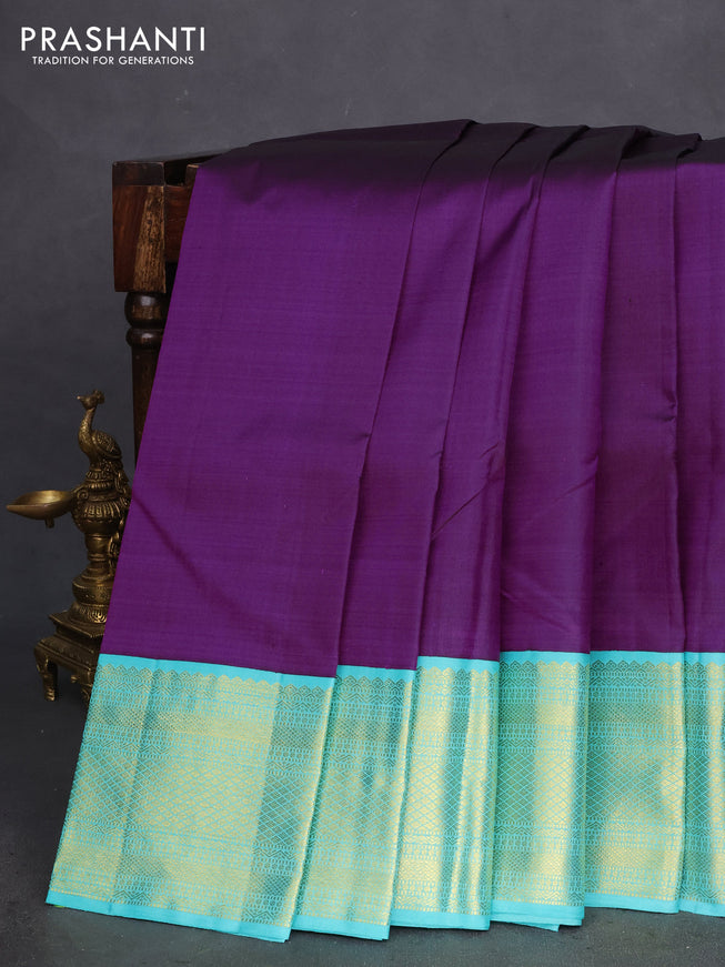 Pure kanchipuram silk saree deep purple and teal shade with plain body and zari woven korvai border