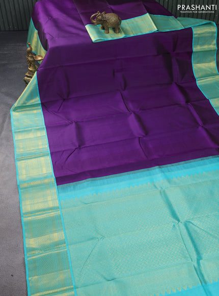 Pure kanchipuram silk saree deep purple and teal shade with plain body and zari woven korvai border