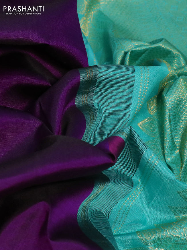 Pure kanchipuram silk saree deep purple and teal shade with plain body and zari woven korvai border
