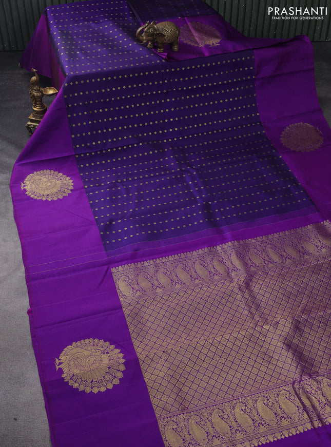Pure kanchipuram silk saree dark blue and purple with allover zari woven floral 1000 buttas and zari woven peacock butta border