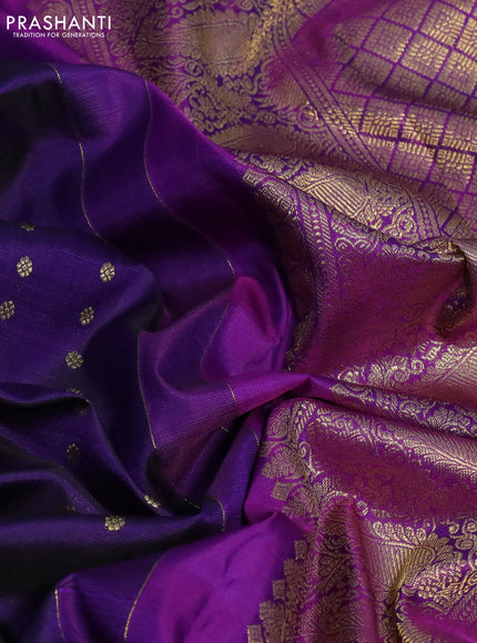 Pure kanchipuram silk saree dark blue and purple with allover zari woven floral 1000 buttas and zari woven peacock butta border
