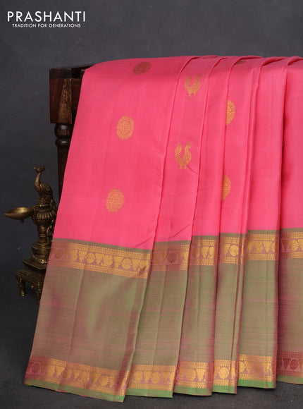 Pure kanchipuram silk saree peach pink and dual shade of teal with zari woven annam buttas and long rettapet zari woven border
