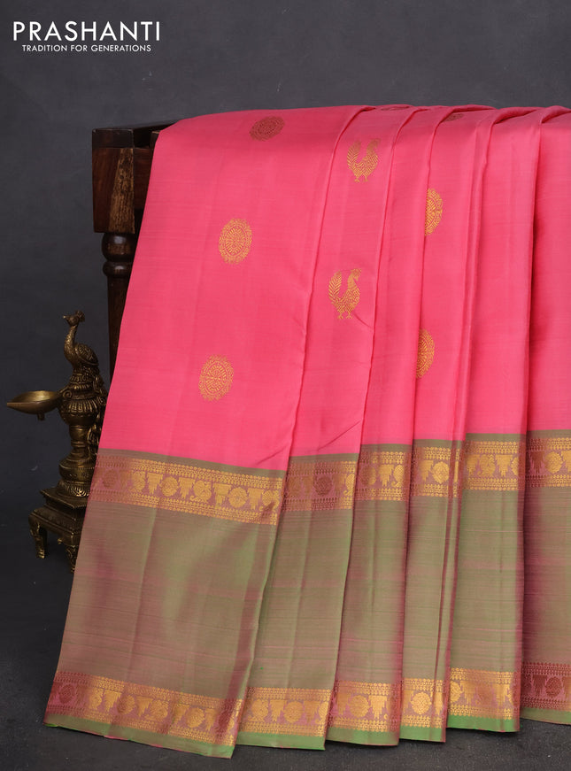 Pure kanchipuram silk saree peach pink and dual shade of teal with zari woven annam buttas and long rettapet zari woven border