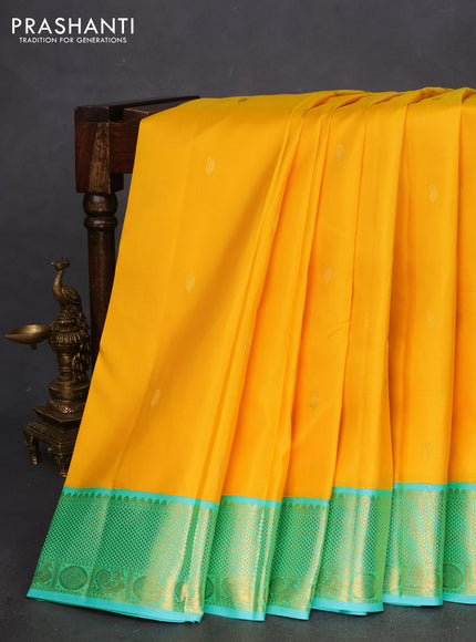 Pure kanchipuram silk saree yellow and dual shade of teal with zari woven paisley buttas and zari woven korvai border