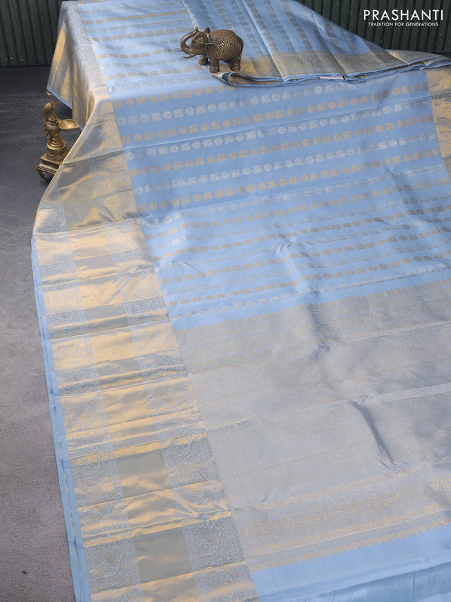 Pure kanchipuram silk saree bluish grey with allover silver & gold zari buttas and long zari woven border