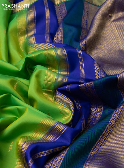 Pure kanchipuram silk saree dual shade of green and royal blue pink with zari woven buttas and rettapet zari woven border
