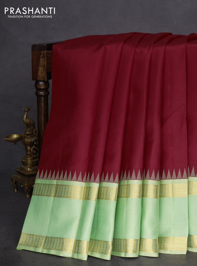 Pure kanchipuram silk saree red and mild pista green with plain body and rettapet zari woven border