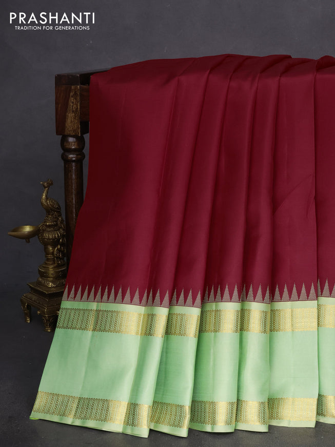 Pure kanchipuram silk saree red and mild pista green with plain body and rettapet zari woven border