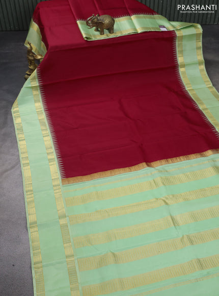 Pure kanchipuram silk saree red and mild pista green with plain body and rettapet zari woven border