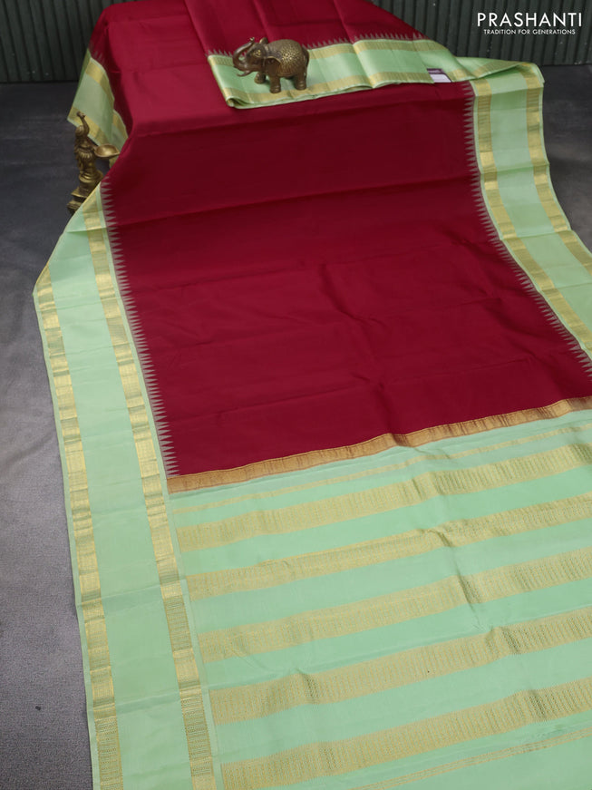 Pure kanchipuram silk saree red and mild pista green with plain body and rettapet zari woven border