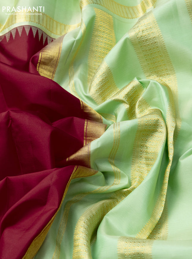 Pure kanchipuram silk saree red and mild pista green with plain body and rettapet zari woven border