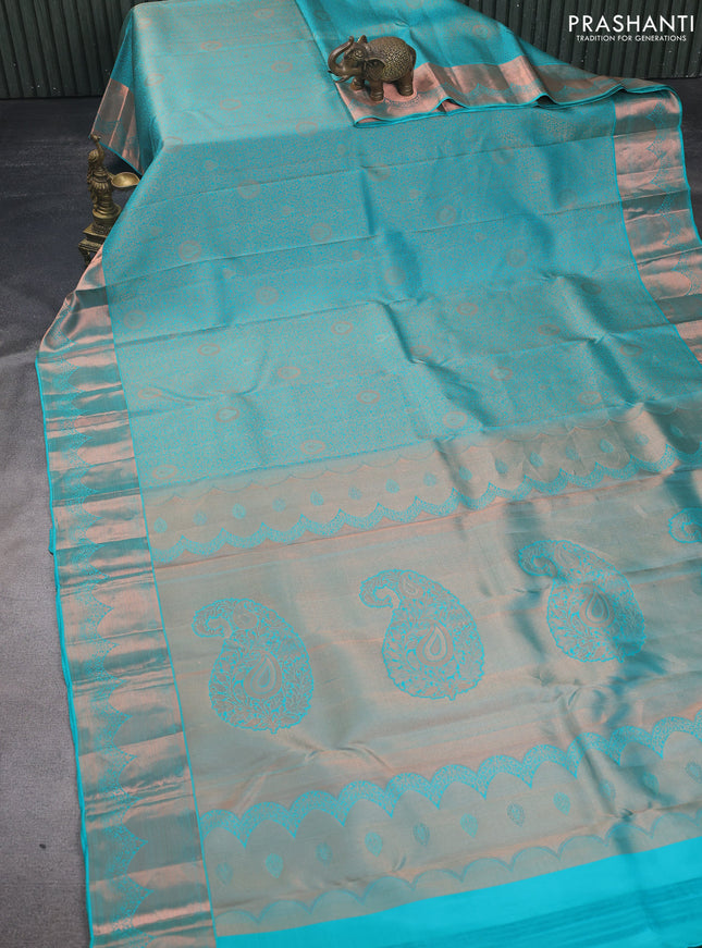 Pure kanchipuram silk saree teal blue shade with allover copper zari wevaes and copper zari woven border