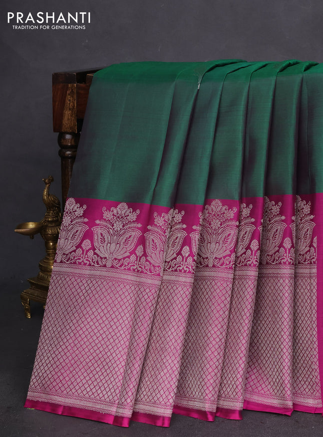 Pure kanchipuram silk saree dual shade of green and purple with silver zari woven peacock buttas and silver zari woven border
