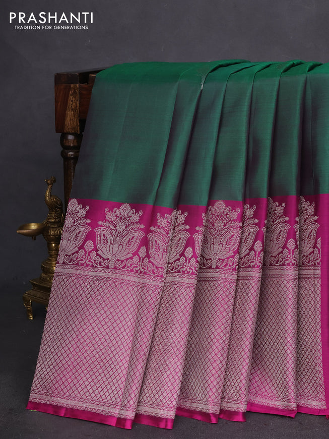 Pure kanchipuram silk saree dual shade of green and purple with silver zari woven peacock buttas and silver zari woven border