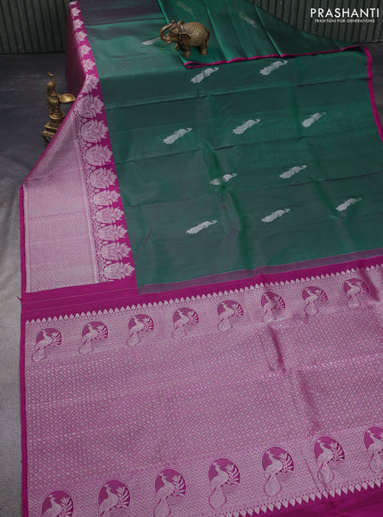 Pure kanchipuram silk saree dual shade of green and purple with silver zari woven peacock buttas and silver zari woven border