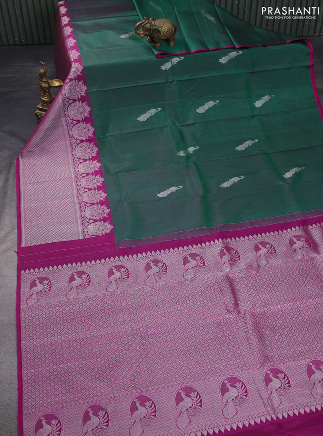 Pure kanchipuram silk saree dual shade of green and purple with silver zari woven peacock buttas and silver zari woven border