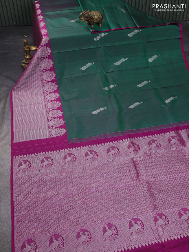 Pure kanchipuram silk saree dual shade of green and purple with silver zari woven peacock buttas and silver zari woven border