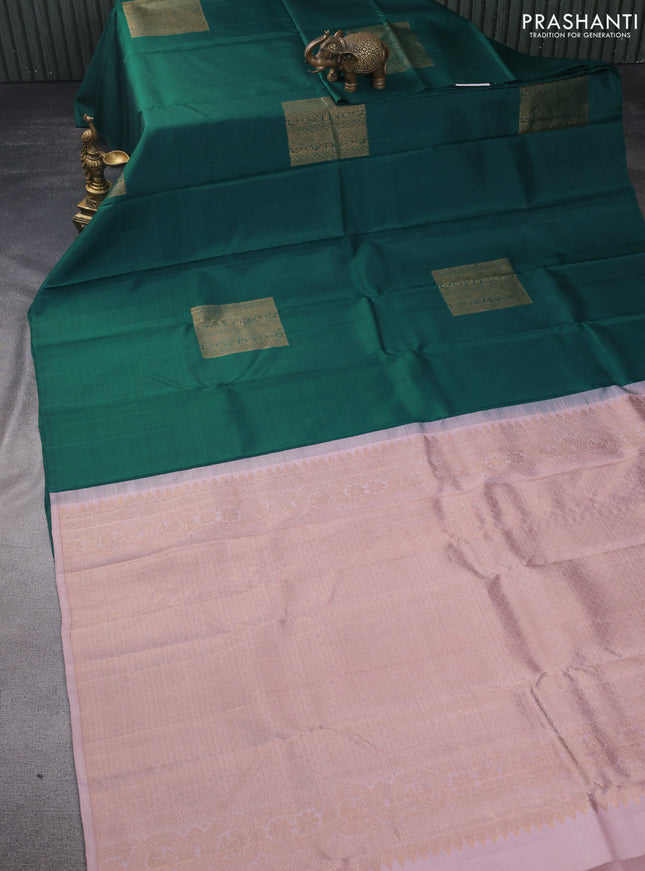 Pure kanchipuram silk saree green and pastel peach shade with box type buttas in borderless style