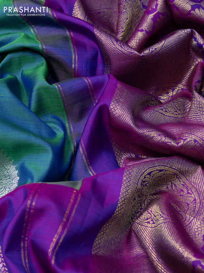 Pure kanchipuram silk saree dual shade of bluish green and dual shade of purple with silver & gold zari woven buttas and long silver & gold zari woven border