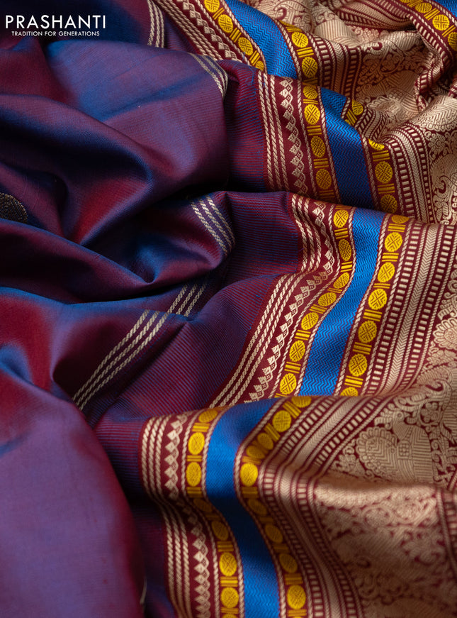 Pure kanchipuram silk saree dual shade of blue and maroon with allover thread buttas and long thread woven border