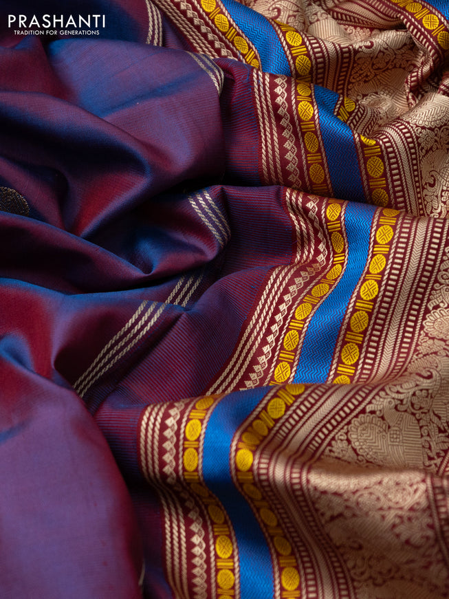 Pure kanchipuram silk saree dual shade of blue and maroon with allover thread buttas and long thread woven border