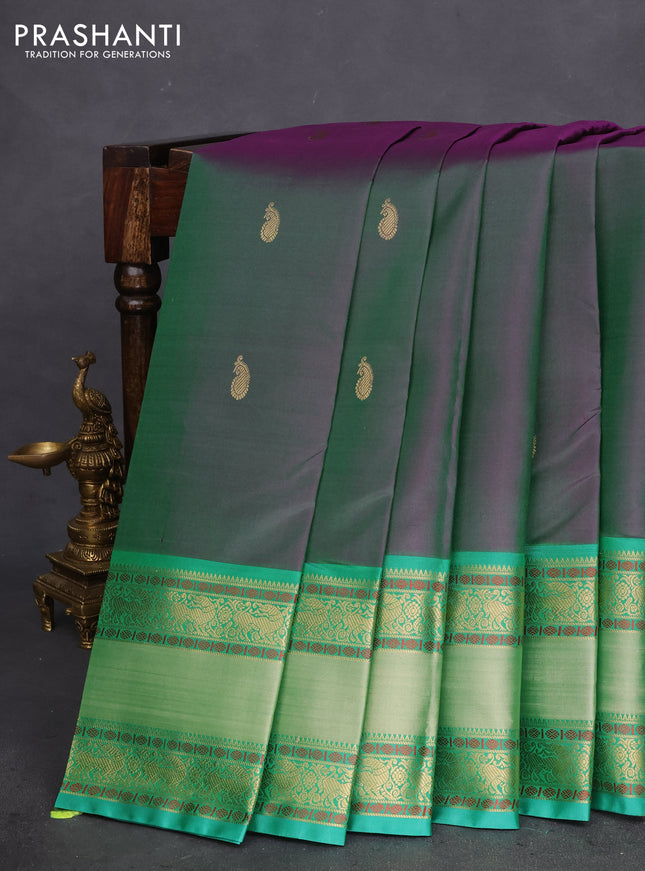 Pure kanchipuram silk saree dual shade of greenish purple and teal green with zari woven buttas and long rettapet zari woven border