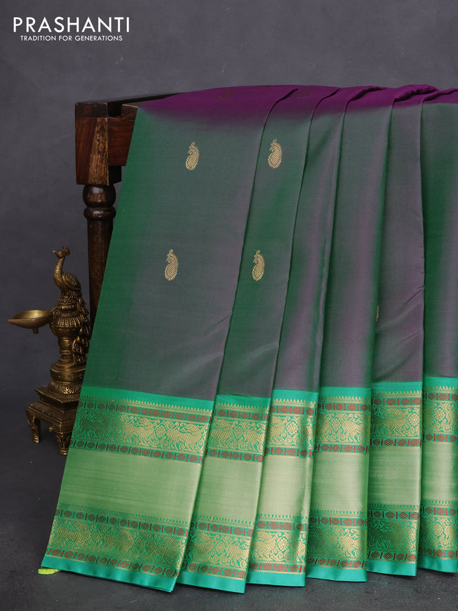 Pure kanchipuram silk saree dual shade of greenish purple and teal green with zari woven buttas and long rettapet zari woven border