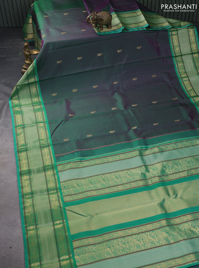 Pure kanchipuram silk saree dual shade of greenish purple and teal green with zari woven buttas and long rettapet zari woven border