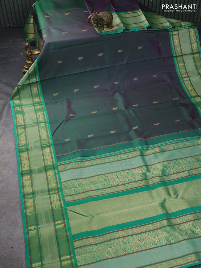 Pure kanchipuram silk saree dual shade of greenish purple and teal green with zari woven buttas and long rettapet zari woven border