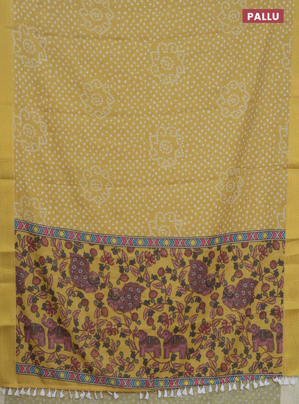 Spun cotton saree yellow with allover bandhani prints and zari woven border